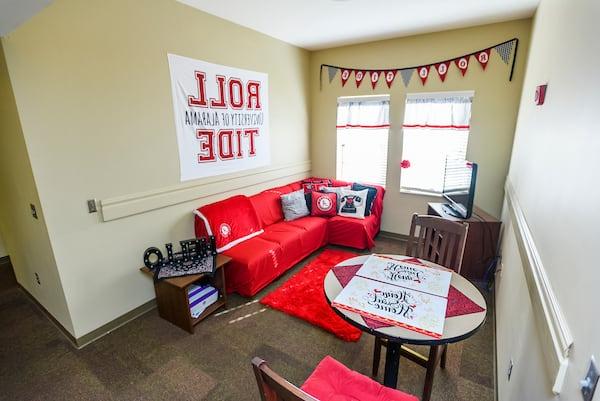 A student's living room decorated with macaugalaxy银河国际 banners.